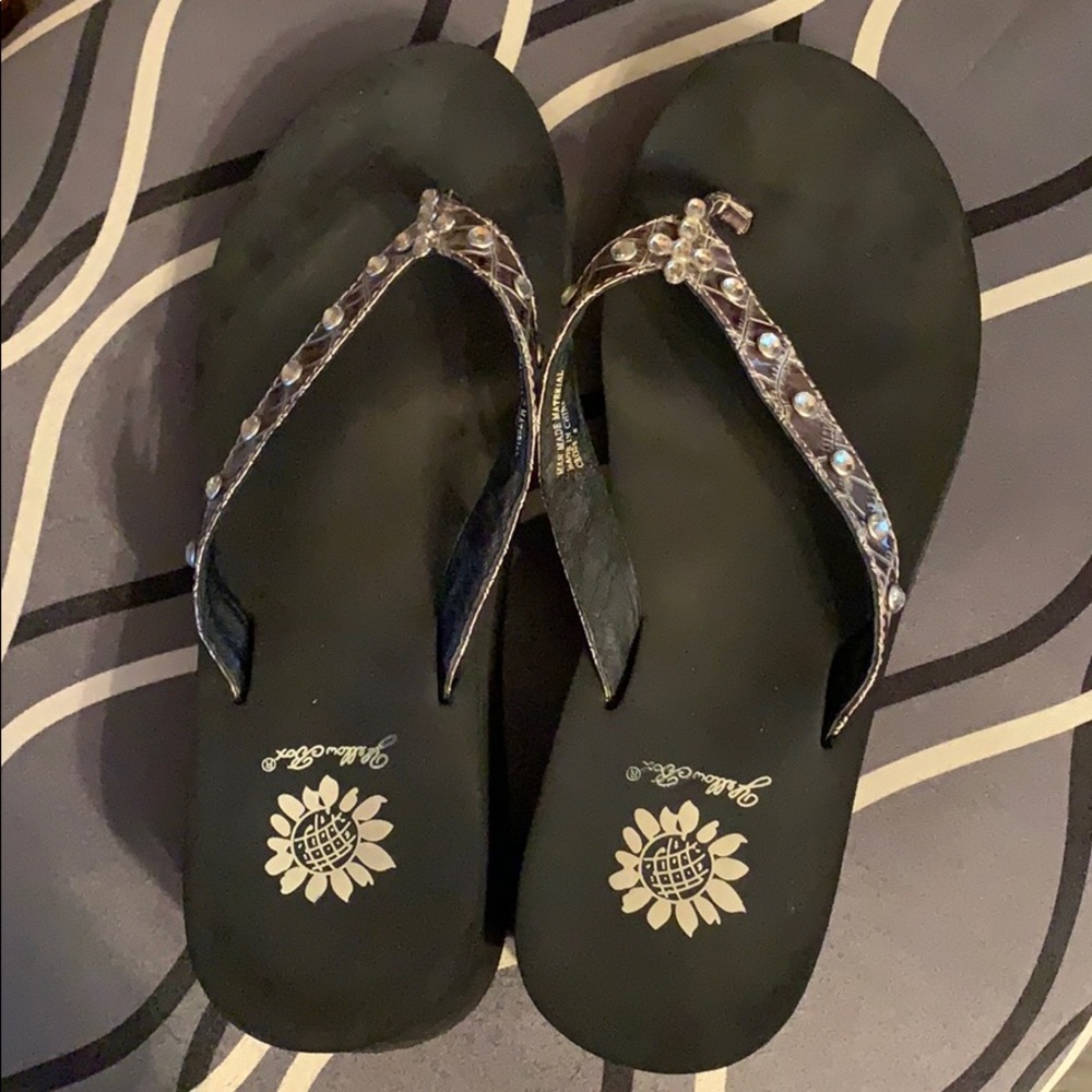 Yellow box flip flops.